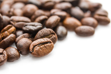  Roasted coffee beans on white
