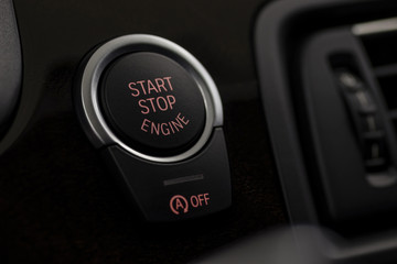 Car engine start and stop button. Interior detail. Macro photo.