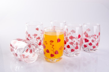 Orange juice in glasses on white background.
