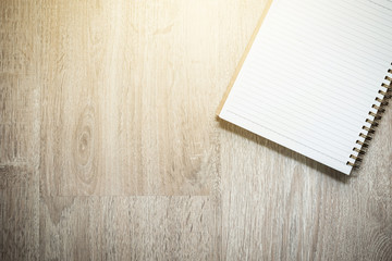 Blank notebook on wood background