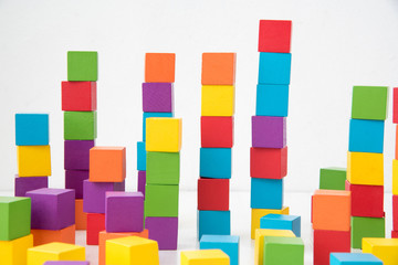 Fototapeta na wymiar Colorful stack of wood cube building blocks