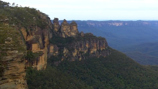 Aerial landscape view of The Three Sisters rock formation in the Blue Mountains of New South Wales, Australia, on the north escarpment of the Jamison Valley.