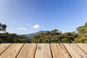 Fototapeta premium wood table with mountain and blue sky