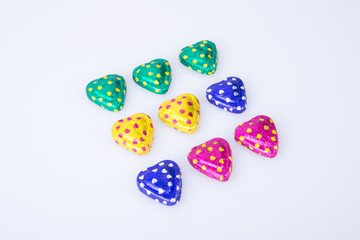 Chocolate or Colorful heart shape chocolate on a background.