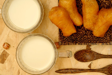 Served breakfast with deep-fried dough stick and Soybean milk in the morning with Flat-lay perspective view