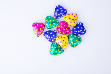 Chocolate or Colorful heart shape chocolate on a background.