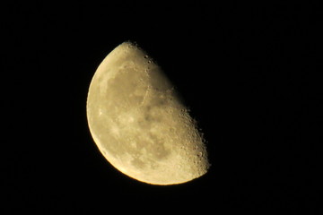 Waning gibbous moon in a dark sky.