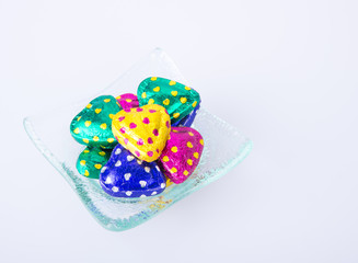 Chocolate or Colorful heart shape chocolate on a background.