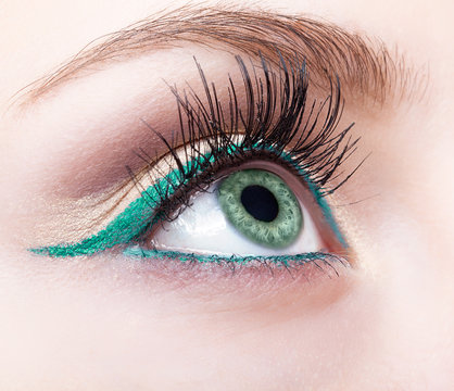 female eye zone and brow with evening green eyeliner makeup