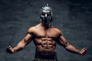 Fotobehang Muscular man in a gladiator silver helmet. © Fxquadro