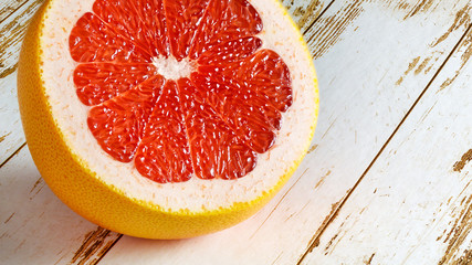 Ripe grapefruits on wooden background