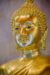  Detail of Buddha gold statues decorating the Buddhist temple in Udon Thani ,Thailand. Photo taken on: 10 November , 2016