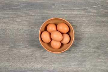 Eggs in deep dish on the table