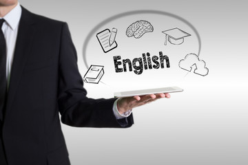 Learn English concept with young man holding a tablet computer