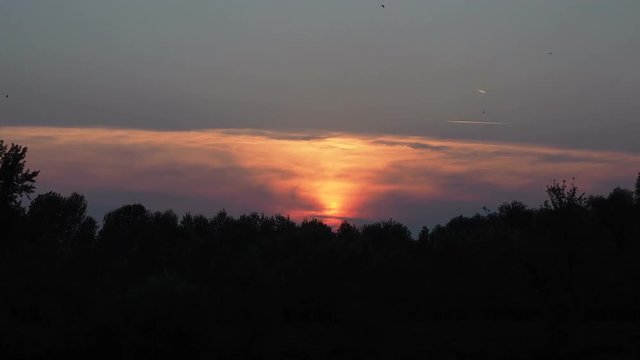 The nature time-lapse of the evening sky with Sunset
