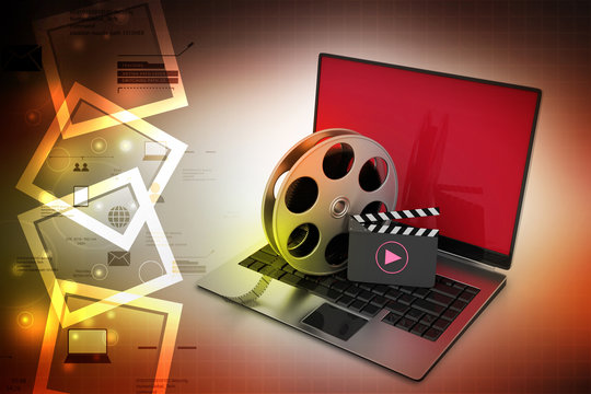 Laptop with reel wheel and clap board in color background