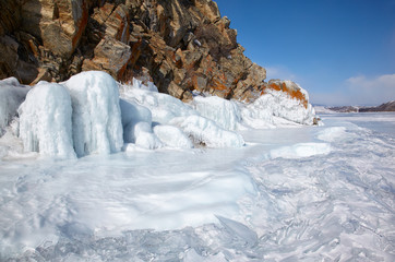 Rocks covered by ice on winter siberian Baikail lake