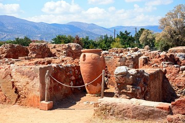 Ancient large decorated terracotta pot within the walls of the Minoan Malia ruins archaeological site, Malia, Crete.