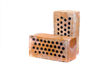 Two red clay brick with holes isolated on white