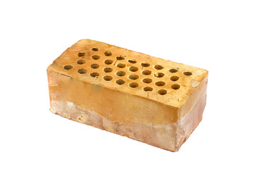 One red clay brick with holes isolated