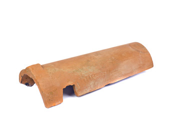 Old clay ceramic roof tile isolated on white