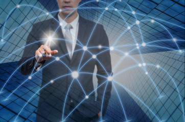 Businessman pointing with digital network line and circles over