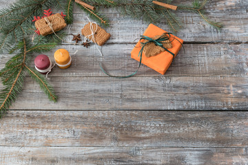 Christmas decorations on a wooden background, top view with copy
