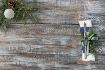Christmas table place setting with christmas tree branches spoon