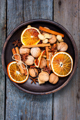 Christmas decorations of dried oranges, cinnamon, anise and nuts