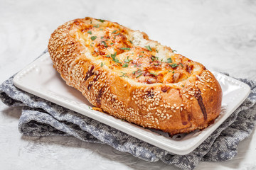 Baked fish casserole in a bread bowl