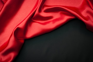 Valentine’s day concept with two silk layers of different colors one red and the other one black...