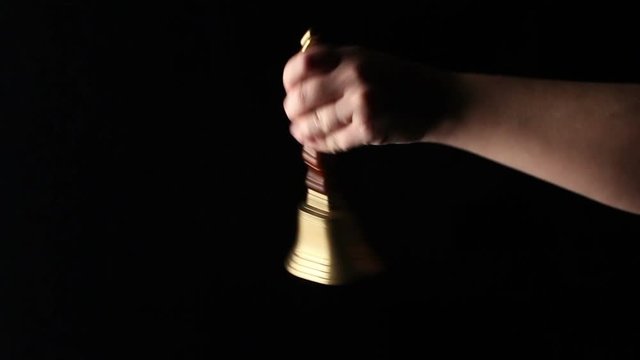 Hand Bell Rings. Isolated Background