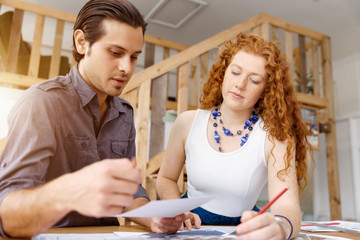 Two young architects in office