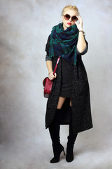 model holding little purse