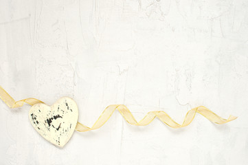 Ribbon and heart on the light background