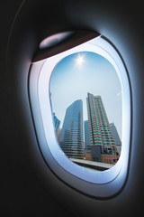 Plane window and view from plane to someplace, plane window with view of people in journey to someplace, plane view and plane window background from the sky, travel business with plane of travel trip.