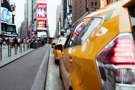 Taxi cabs on busy Time Square road