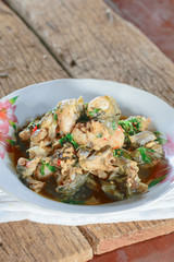 Stir-fried frog and basil on wooden