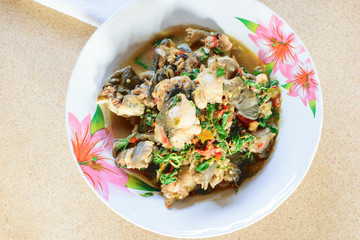 Stir-fried frog and basil  on wooden