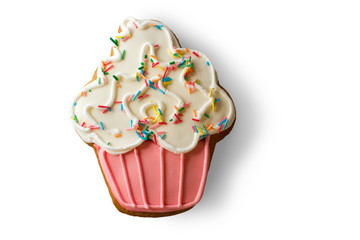 Cookie shaped as cupcake. Biscuit on white background. Taste of joy. Dough and glaze.