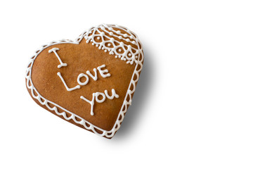 Brown heart shaped cookie. Biscuit with inscription. The most important words. Little present for beloved one.