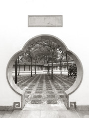 Scenery of Chinese garden with round gate hole