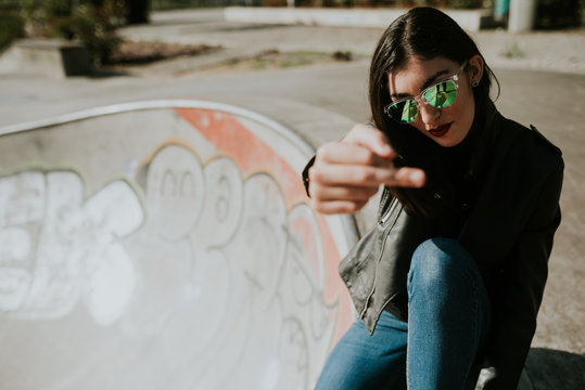 Young woman showing middle finger