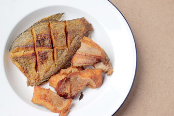 The fried in white dish on wooden background, delicious thai food