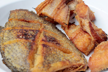 Tasty and spicy fried fish isolated on white background, Thai food