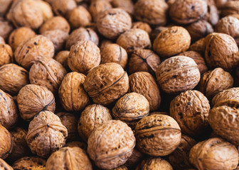 Whole walnuts background. Close up, top view.