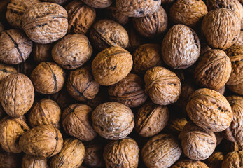 Whole walnuts background. Close up, top view.