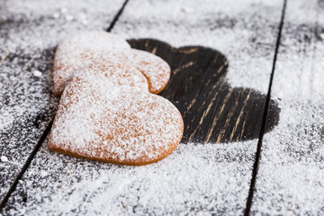 Heart shaped ginger valentine cookies with  powdered sugar