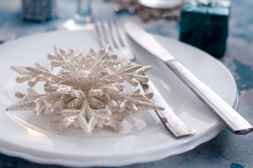 Silver and cream Christmas Table Setting with decorations