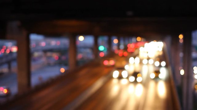 Abstract circular bokeh motion lens blur backround of city and street light on rainy day at night time in Thaialnd